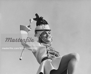 838-02486924 © SuperStock / Masterfile Model Release: Yes Property Release: No Low angle view of a drum majorette performing with a twirling baton